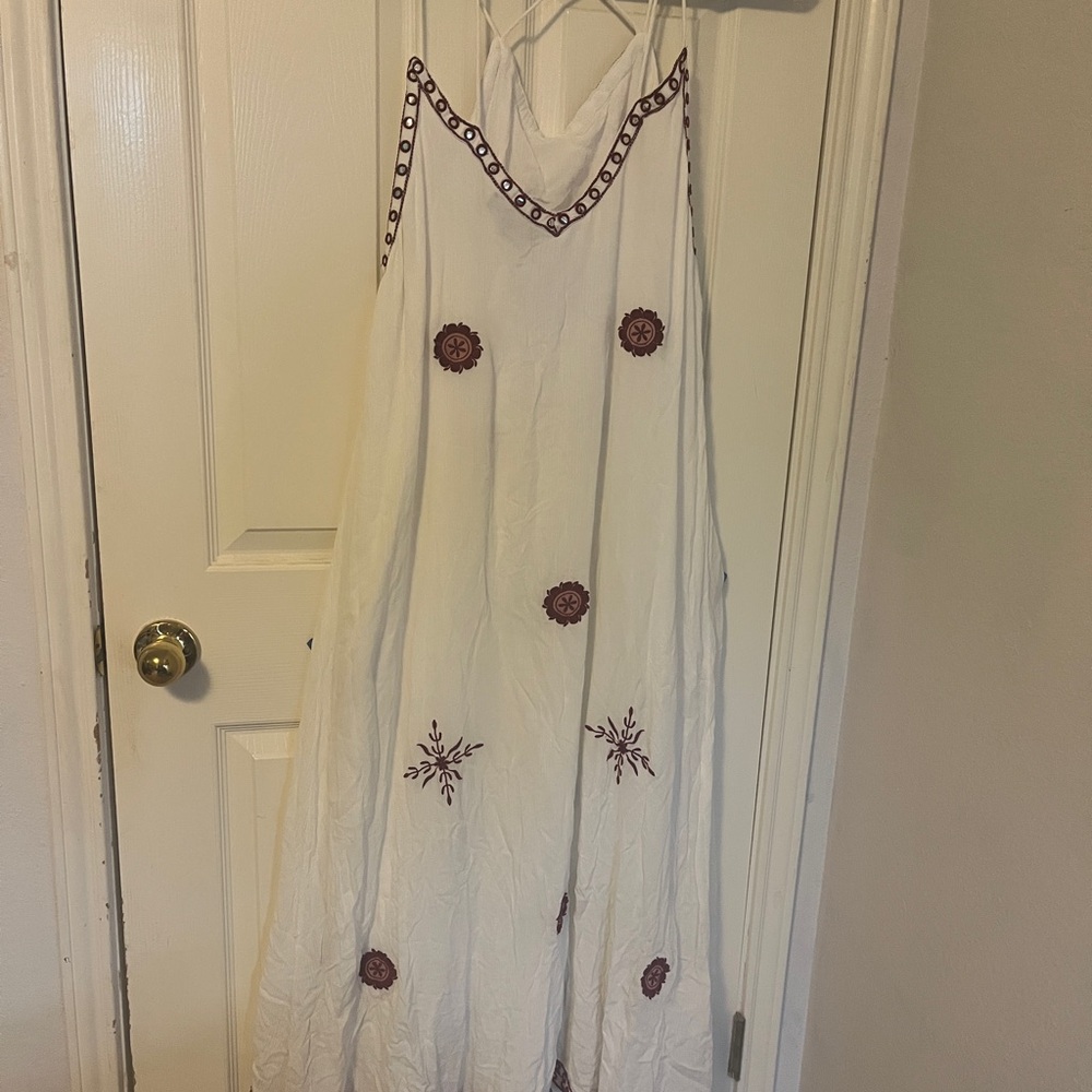 White sundress with maroon embroidered accents. High Low